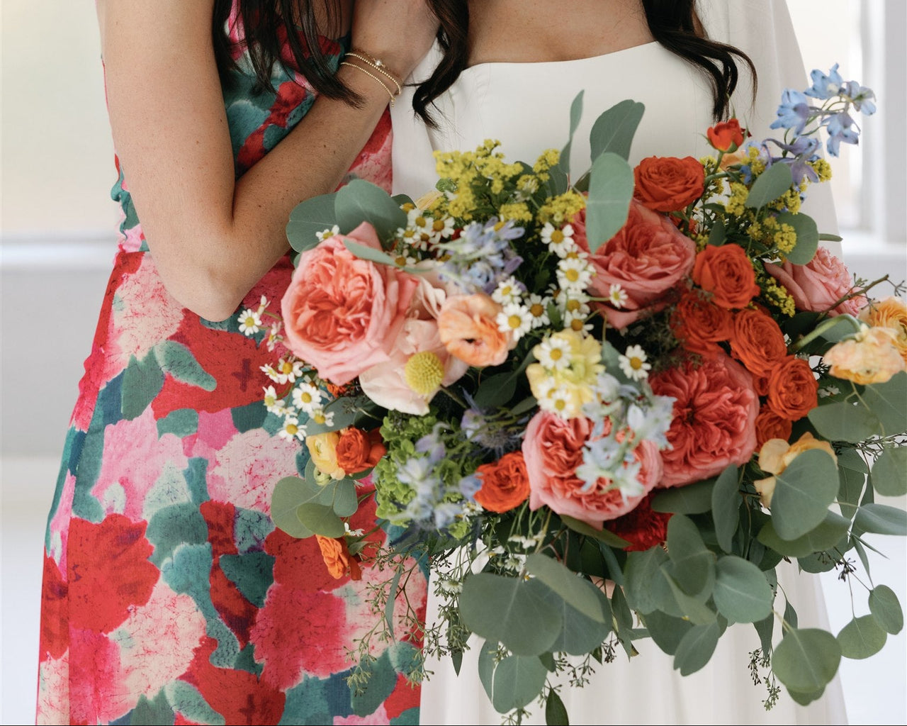 spring wedding bouquet coral roses greenery McKinney TX florist