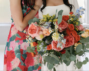 spring wedding bouquet coral roses greenery McKinney TX florist